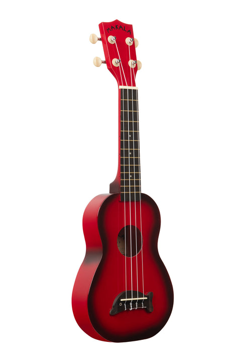 A Red Burst Soprano Dolphin Ukulele shown at a right angle
