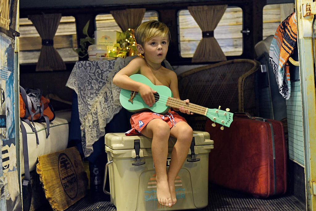 Child Playing a Sea Foam Green Soprano Makala Shark At Surf Expo 2018 (Kala)